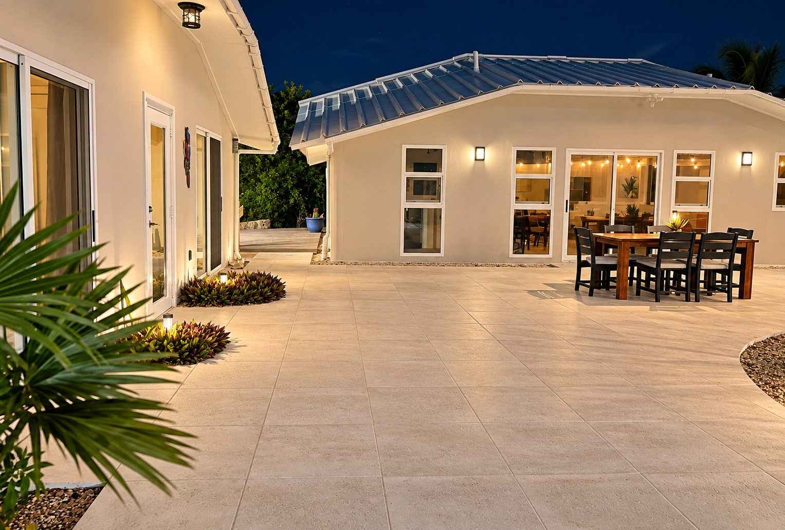 Thoughtfully placed landscape lighting illuminates the gardens and walkways, creating a warm, welcoming ambiance while providing added safety and security after sunset.